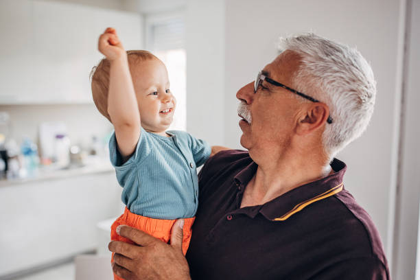 istock Grandfather holding grandson 1324202476