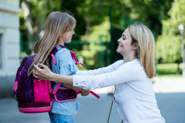 istock Mother sending her daughter back to school 1324207511