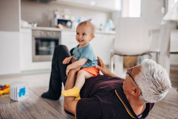 istock Grandfather playing with grandson 1324210371