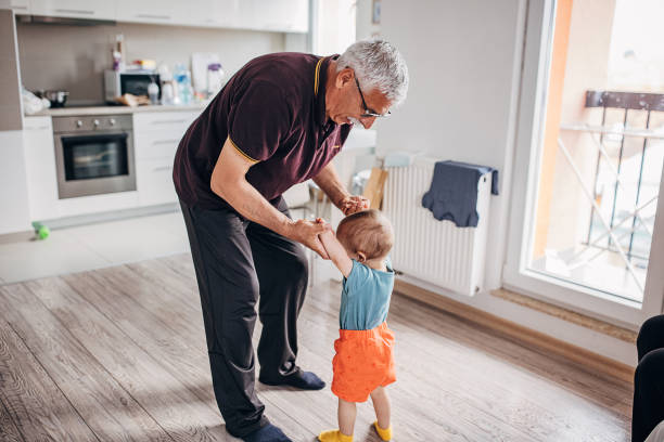 istock Grandfather with grandson at home 1324211416
