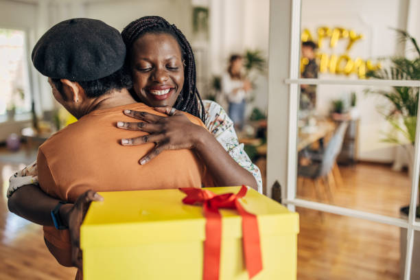 istock Woman receiving birthday present 1324213393