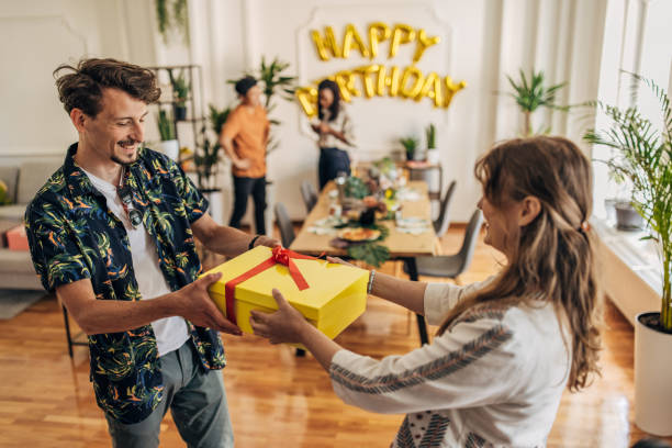 istock Friends bringing birthday presents 1324213775