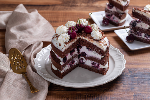 Black forest cake on a white isolated background. toning. selective focus
