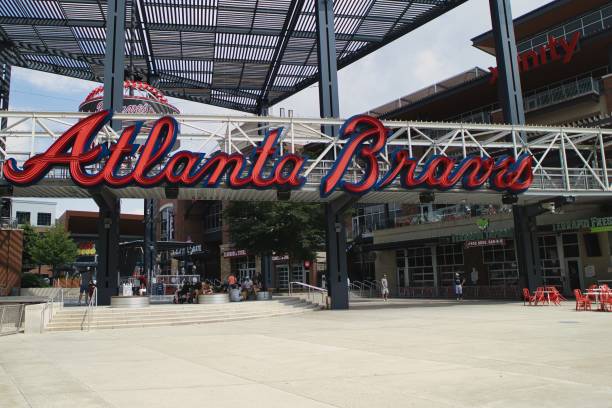 Entrance to Truist stadium in Atlanta, GA Atlanta, GA, USA: June 12,2021-An entrance to Truist Stadium in  Atlanta, Georgia. The stadium is a ballpark and the home field of Major League Baseball team of Atlanta Braves and is located in a multi use complex The Battery with many shops and restaurants. american league baseball stock pictures, royalty-free photos & images