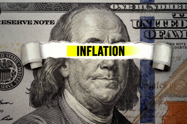 istock Torn bills revealing Inflation words. Idea for FED consider interest rate hike 1324217773