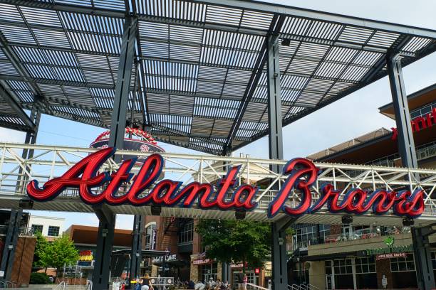 Entrance to Truist stadium in Atlanta, GA Atlanta, GA, USA: June 12,2021-An entrance to Truist Stadium in  Atlanta, Georgia. The stadium is a ballpark and the home field of Major League Baseball team of Atlanta Braves and is located in a multi use complex The Battery with many shops and restaurants. american league baseball stock pictures, royalty-free photos & images