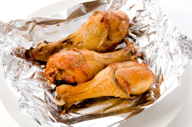 istock Grill Chicken Legs on Aluminum Foil 1324218433