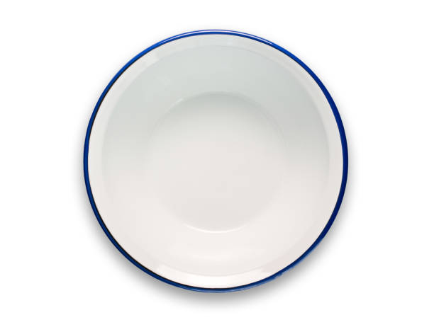 ciotola di smalto bianco con bordo blu isolato su bianco - plate blue dishware white foto e immagini stock