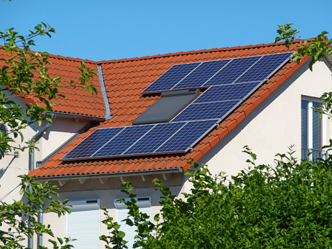 Solar panel on roof of farm house.