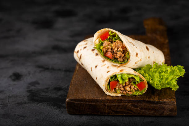 istock Mexican burritos stuffed with beef and salad. 1324222119