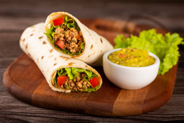 istock Mexican burritos stuffed with beef and salad. 1324222132