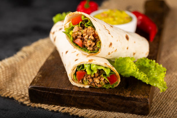 istock Mexican burritos stuffed with beef and salad. 1324222147