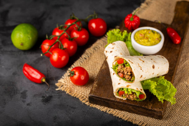 istock Mexican burritos stuffed with beef and salad. 1324222153