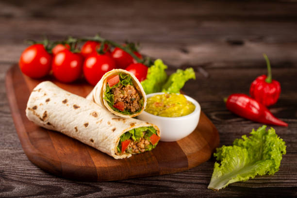 istock Mexican burritos stuffed with beef and salad. 1324222170