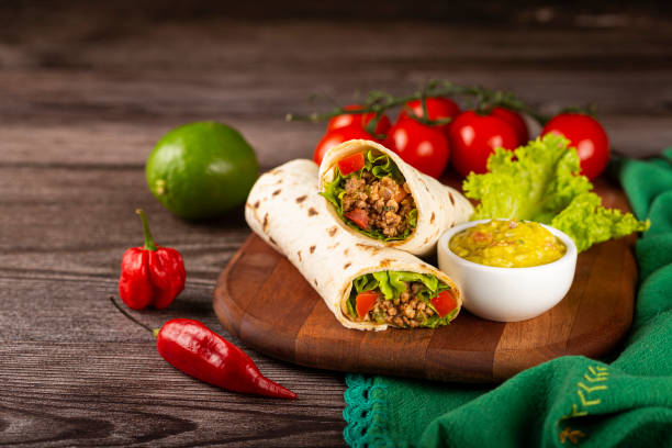 Mexican burritos stuffed with beef and salad. Mexican burritos stuffed with beef and salad. burrito photos stock pictures, royalty-free photos & images