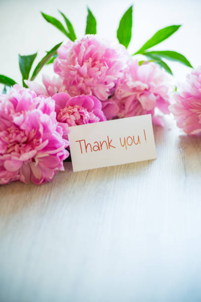 istock several branches of blooming pink peonies on a wooden table 1324223054