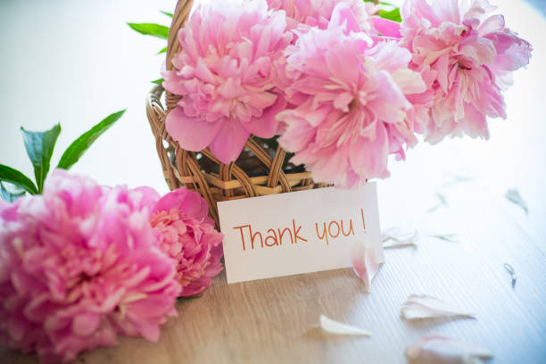 istock several branches of blooming pink peonies on a wooden table 1324223140