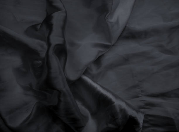 istock black wrinkled satin fabric 1324226092