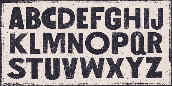 Vector distressed old sans serif alphabet. Black letters on white weathered texture background.