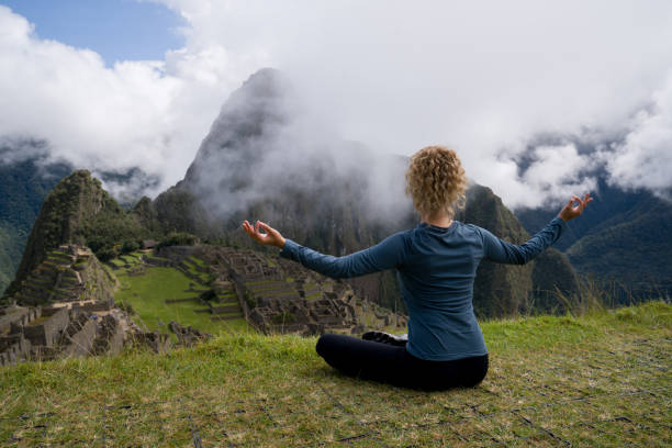 istock Peaceful woman meditating in Machu Picchu 1324227696