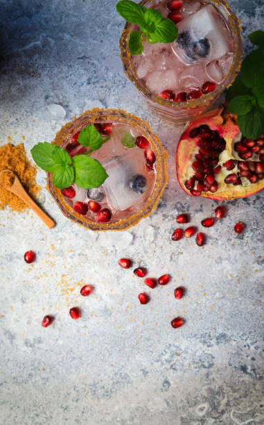 istock Two summer cocktails with pomegranate and mint 1324228933