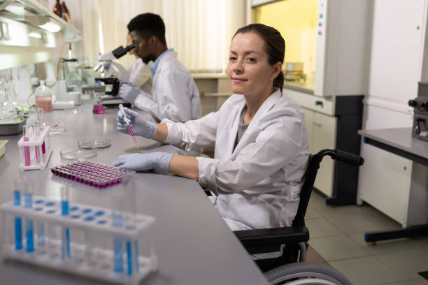 istock Successful disable female scientist in wheelchair 1324230860