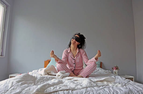 istock young beautiful woman waking up in her bed 1324230911