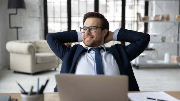 istock Happy manager relaxing at workplace in office, enjoying work break 1324235303