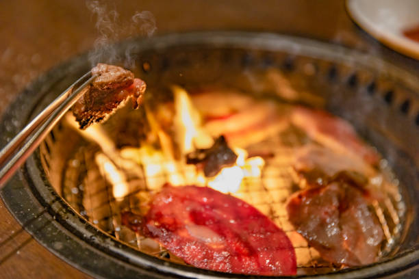 istock Delicious meat grilled over charcoal 1324236427