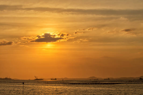 istock Ship and sunset behind clouds over in the sea 1324237859