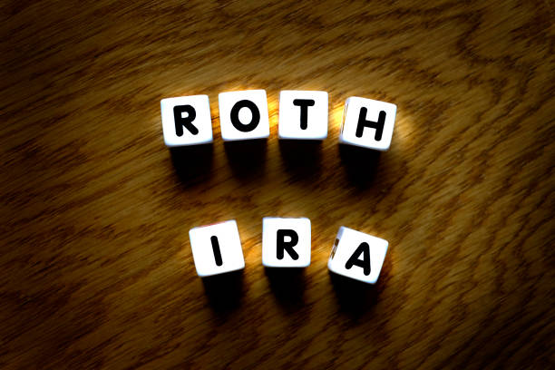 roth ira spelled out with dice for retirement planning and savings investments - retirement investment capital letter text imagens e fotografias de stock