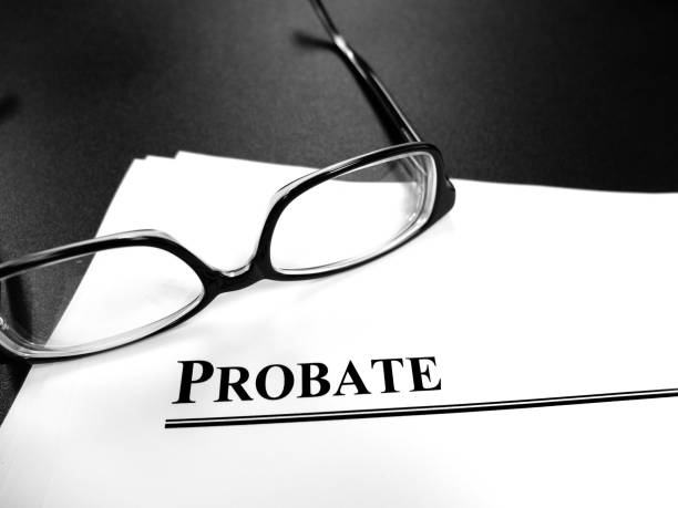 Probate last will and testament Estate Planning documents on desk with glasses stock photo