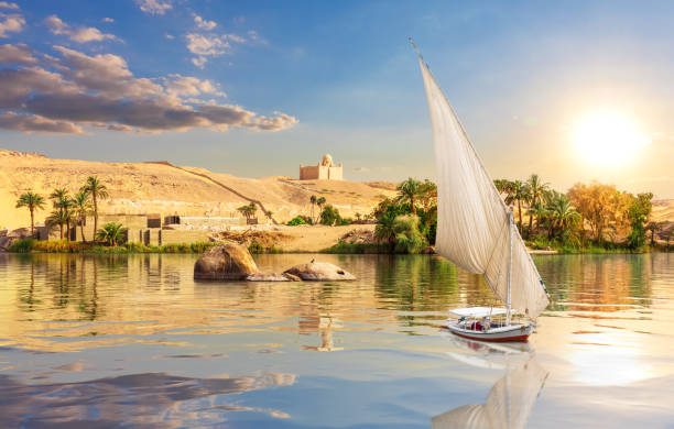 The Nile and traditional African village near Aswan, Egypt stock photo