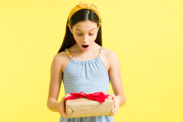 istock Happy preteen can't believe she got a gift 1324252826