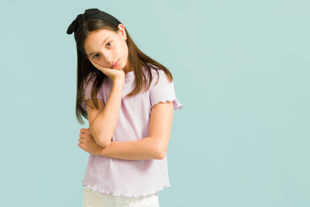 istock Pretty girl feeling tired and looking at the camera 1324253008
