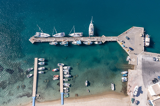 Ios island, marina port aerial drone view. Greece, Cyclades.