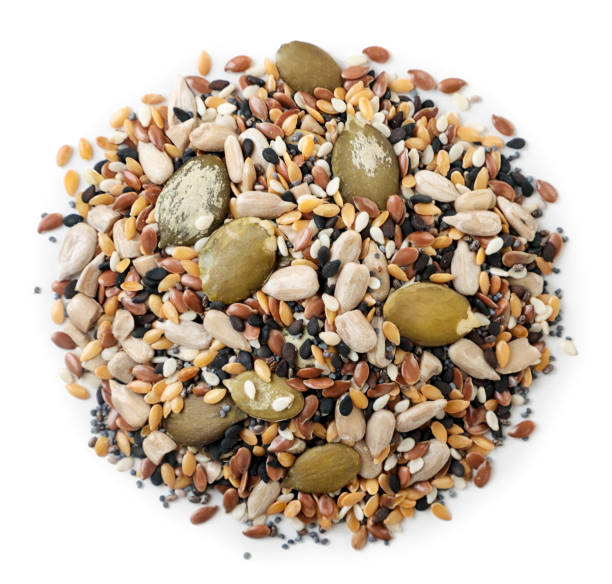istock Heap of mix seeds on a white. Top view, 1324256929