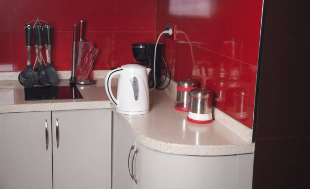 istock Set of cookware, white kettle in kitchen. 1324258159