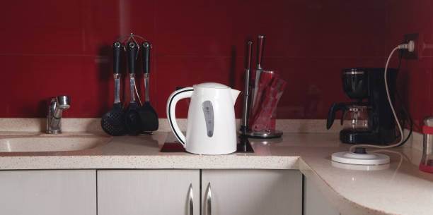 istock Set of cookware, white kettle in kitchen. 1324258170