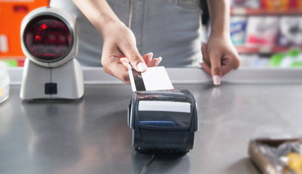 istock Customer making payment using credit card in a supermarket. 1324258205