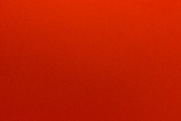 istock Red background. Sheet of blank red paper, close up. 1324259407