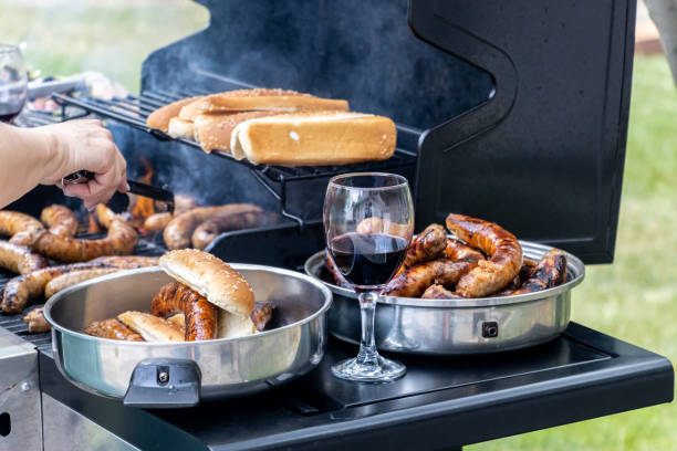 istock Hot-dog and sausage on barbecue grill. 1324259511