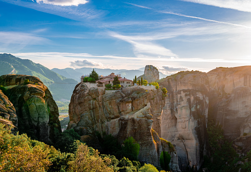 The Monastery of the Holy Trinity, in Meteora, Greece. Scenic landscape in the sunset.