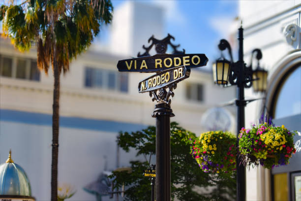 Rodeo Dr, famous street sign in Beverly Hills. Road intersection sign at Via Rodeo Dr and N Rodeo Dr,  Rodeo Drive in Beverly Hills California. los angeles county stock pictures, royalty-free photos & images