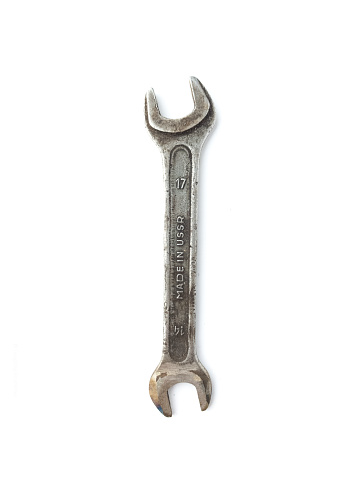Old Rusty wrench spanner isolated on white background