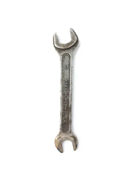 Photo of Old Rusty wrench spanner isolated on white background