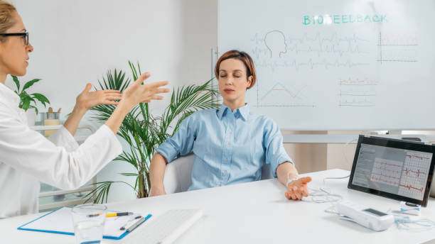 istock Respiratory Biofeedback Training. Biofeedback Therapist Monitoring Breathing Patterns 1324267126