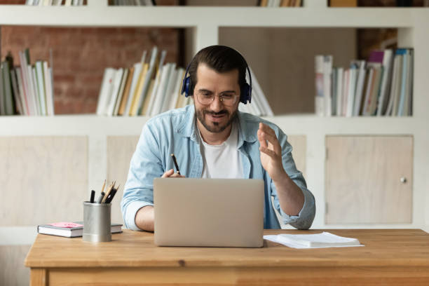 istock Happy millennial gen man holding video call meeting. 1324267918