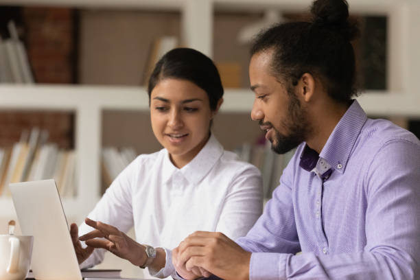 istock Happy motivated young multiracial colleagues working on online project. 1324268024