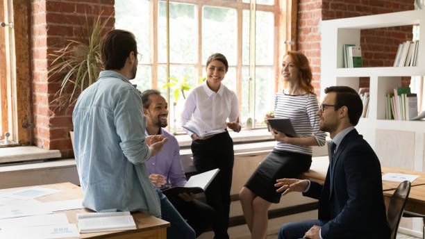 istock Happy inspired young mixed race colleagues discussing business ideas. 1324268074